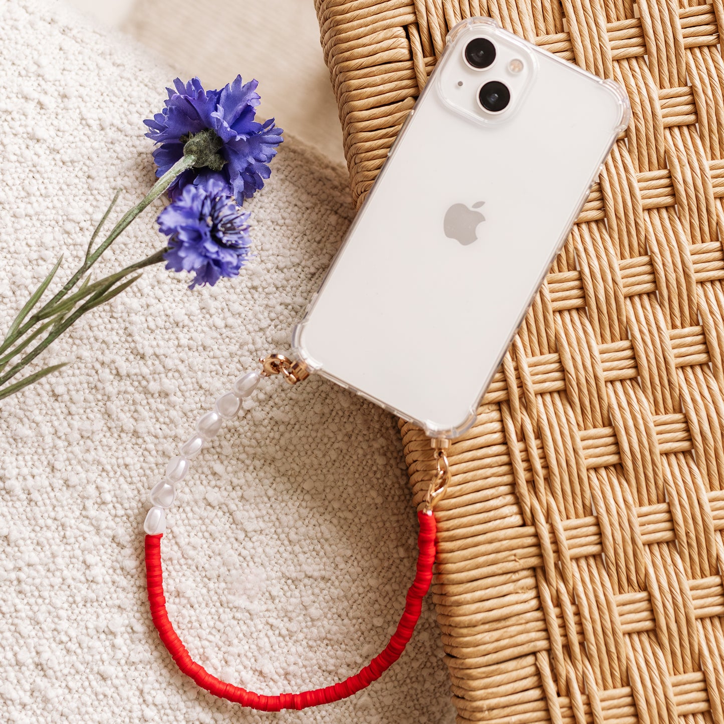Phone case with red & pearl cord