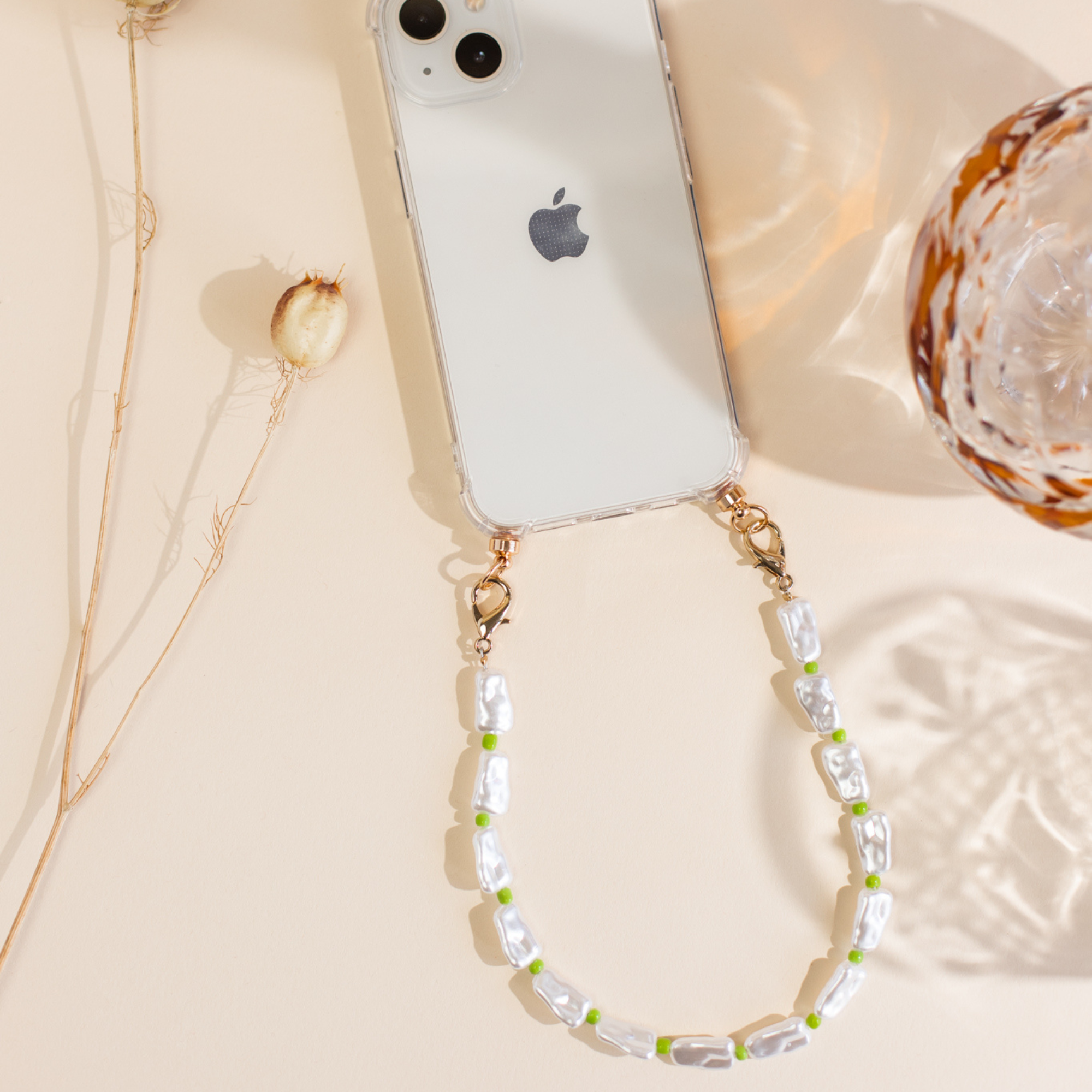 Phone case with green swirl cord