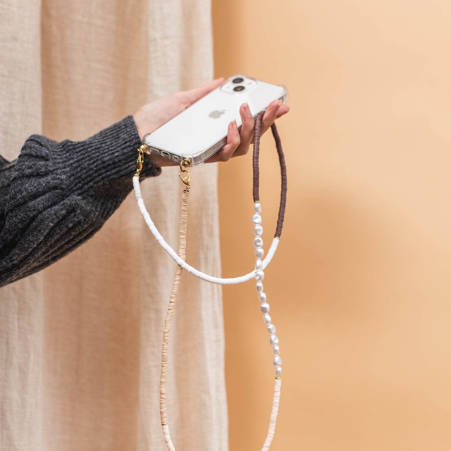 Phone case with long cozy cord