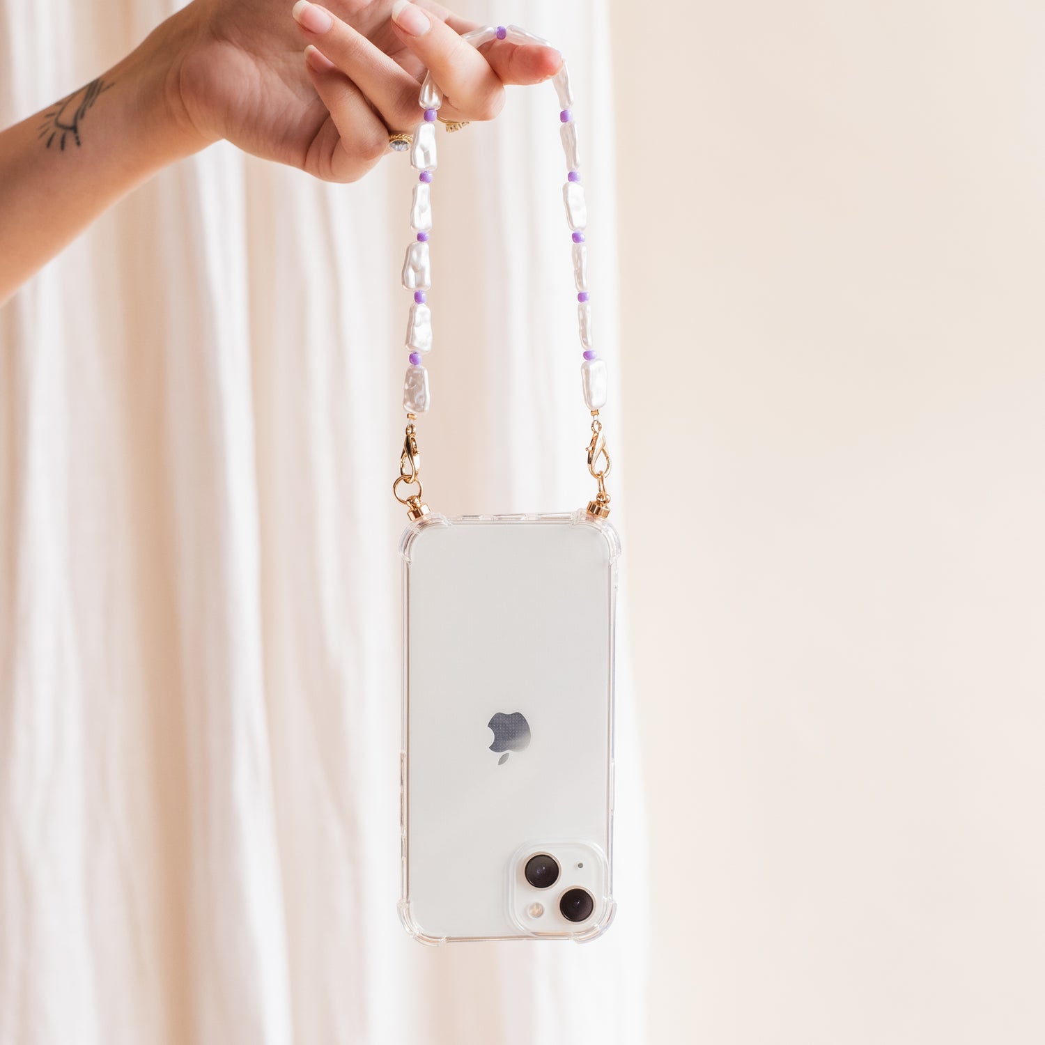 Phone case with purple swirl cord