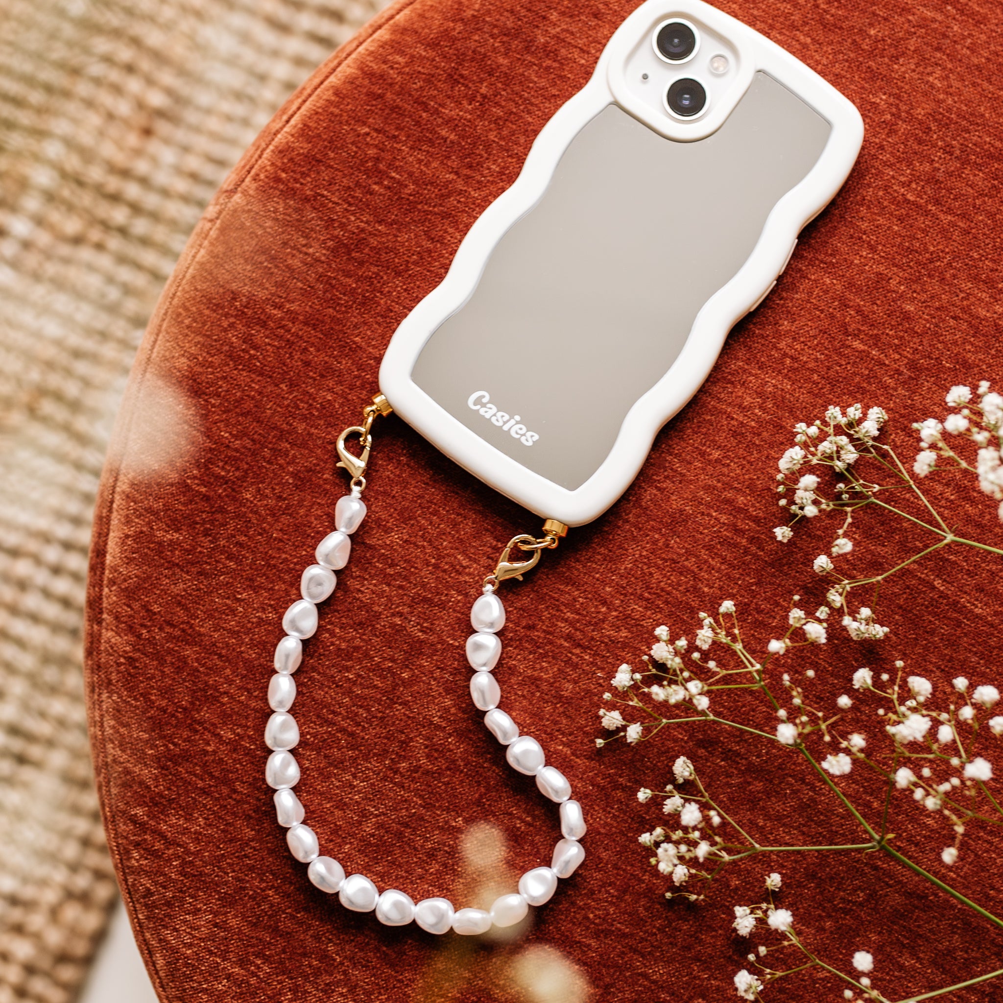 Wavy mirror phone case with pearl cord